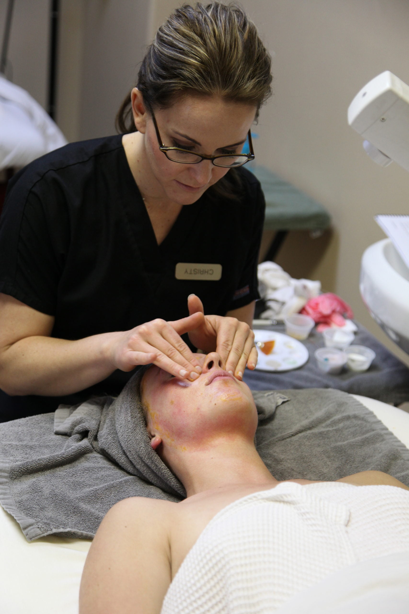 Young woman receiving a facial massage at spa | Mandalyn Academy In American Fork, UT