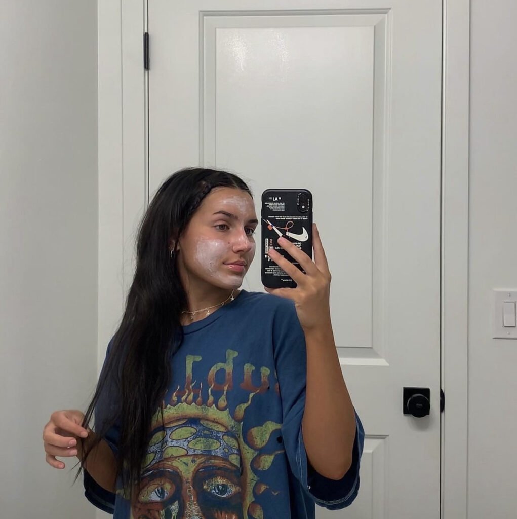 A Cute lady applied facial cream on face and took a selfie | Mandalyn Academy in American Fork UT
