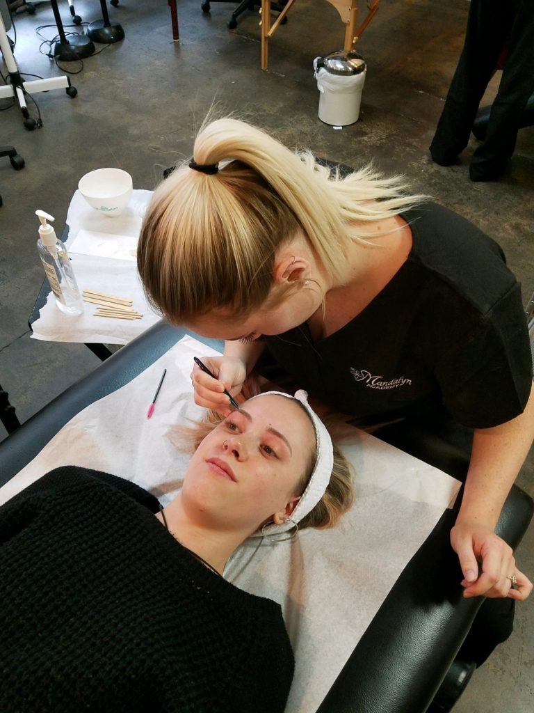 A Woman Getting eyebrow treatment | Mandalyn Academy in American Fork UT