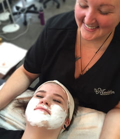 A Woman taking facials on her face | Mandalyn Academy in American Fork UT