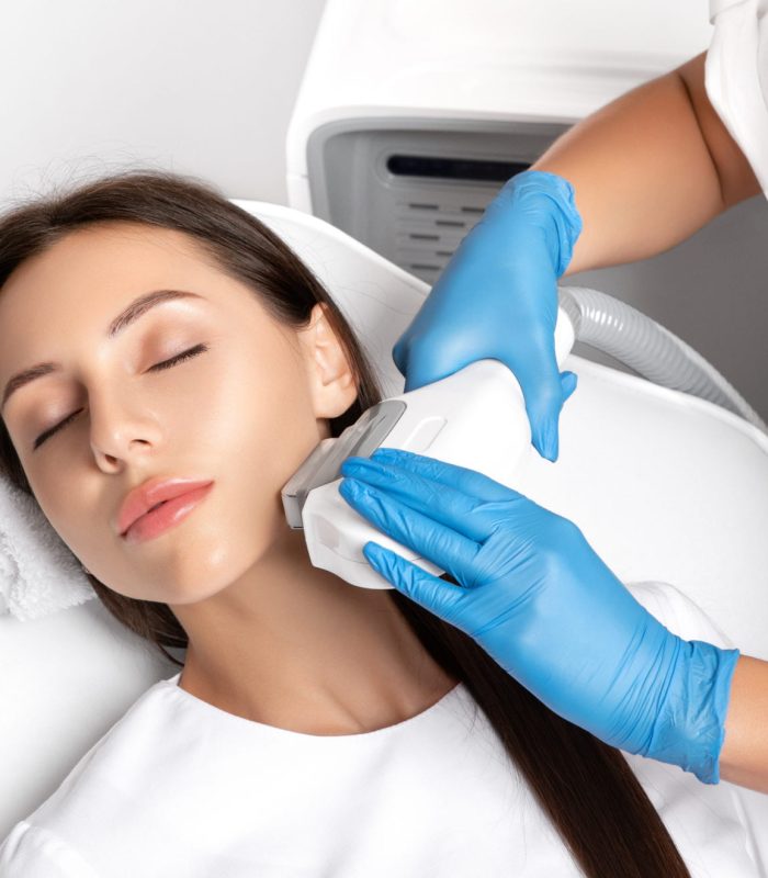 Elos epilation hair removal procedure on the face of a woman. Beautician doing laser rejuvenation in a beauty salon. Facial skin care. Hardware  ipl cosmetology