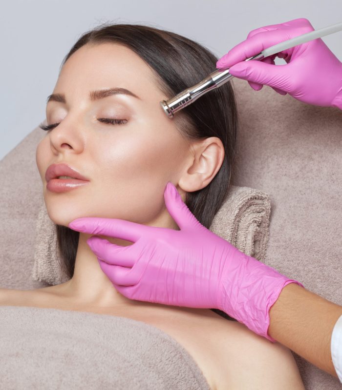 Attractive Woman Undergoing Microdermabrasion Treatment | Mandalyn Academy in American Fork, UT